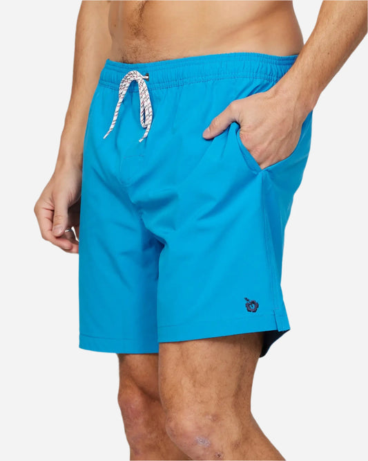 Left side view of the Okanui Mens Onboard stretch swim short in Blue