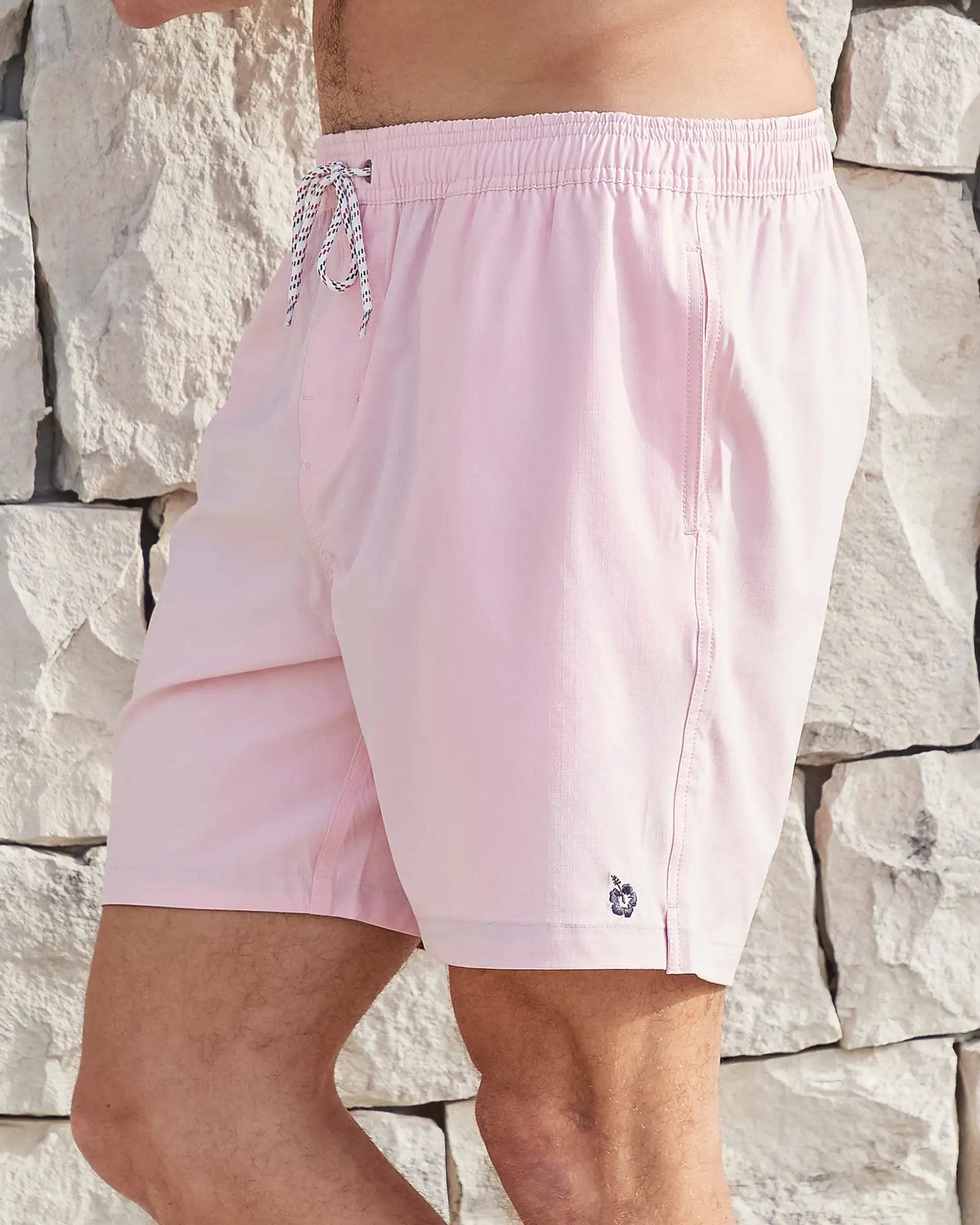 Left side view of the Okanui Mens Onboard stretch swim short in Pink