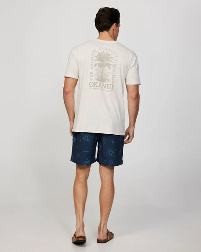 Full body back view of a male model wearing the Okanui Mens Barrel Tee T-shirt in Stone