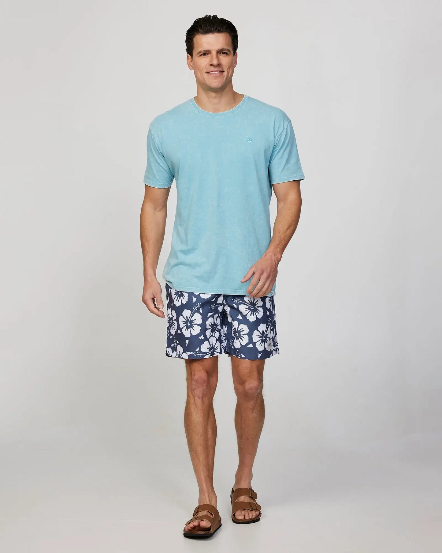 Full body front view of a male model wearing the Okanui Mens Staple Tee T-shirt in Seafoam