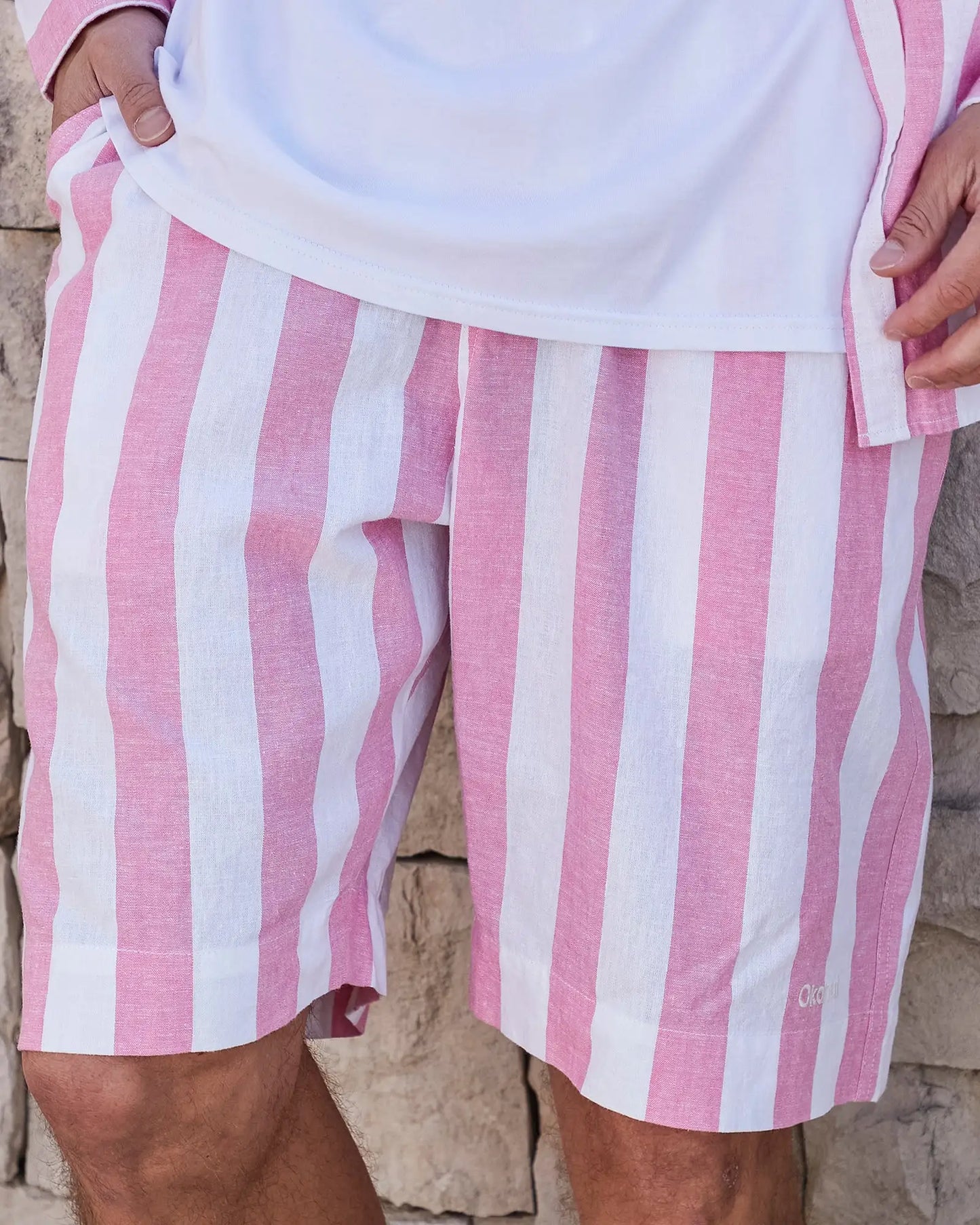 Front view of the Okanui Mens Classic Stripe Walk short in Pink