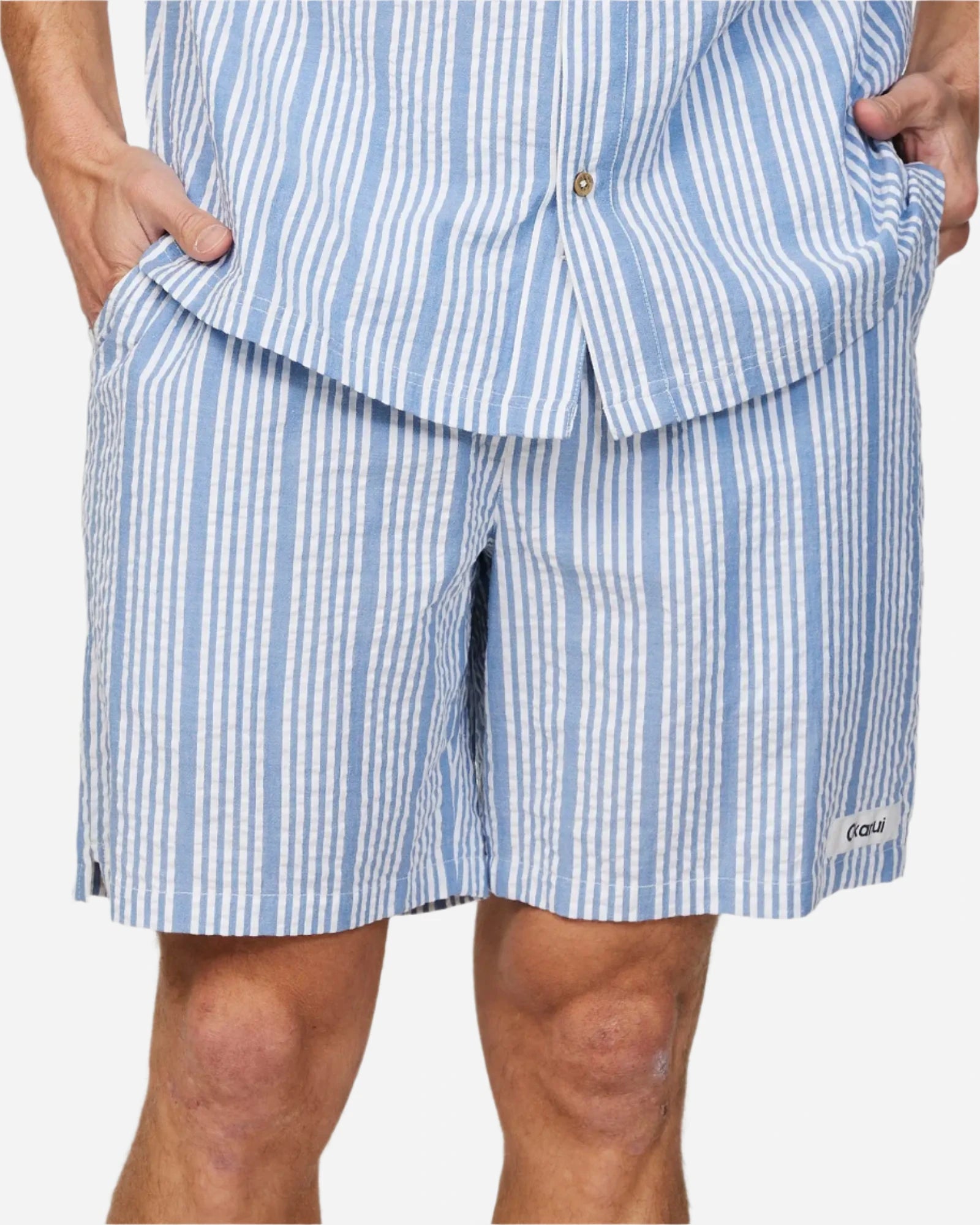 Front view of the Okanui Mens Starboard walk short in Blue Stripes paired with a blue stripe shirt