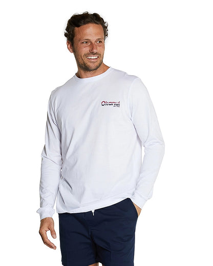 The same view of the model wearing the Okanui Classic long sleeve white t-shirt in a different pose.