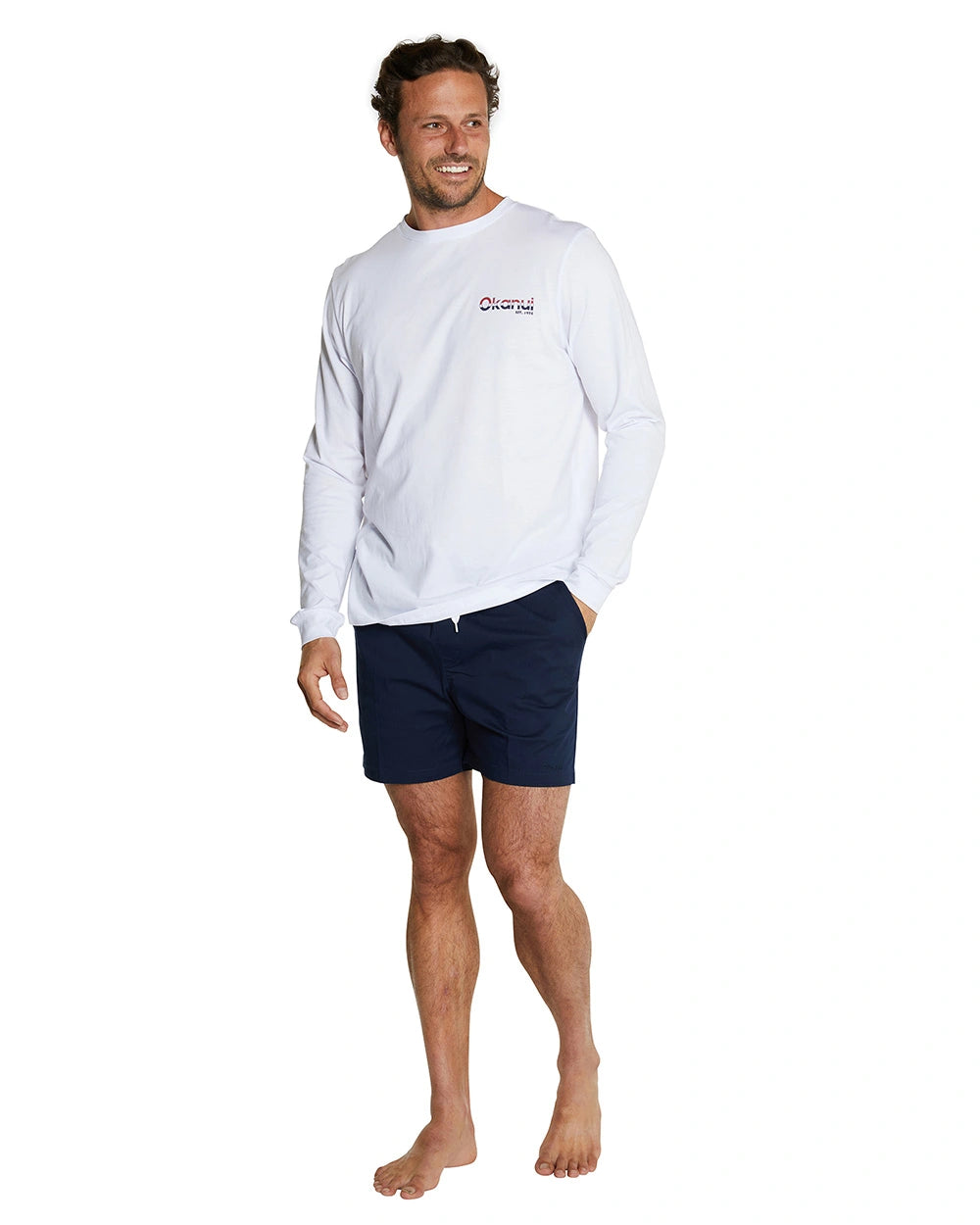 This is a front view of the Okanui Classic men's long sleeve t-shirt in white, featuring an Okanui logo on the left side of the chest.