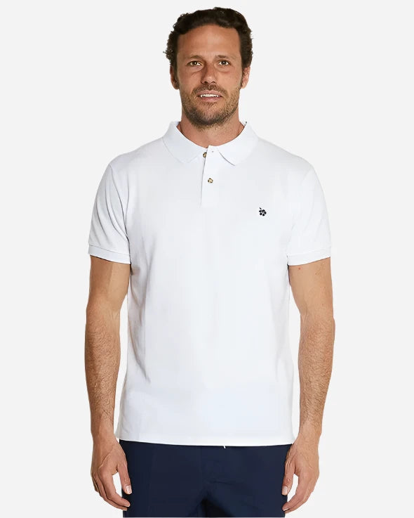 A model wearing the Okanui Classic Polo Shirt for men in white color.