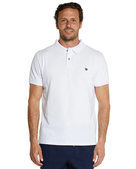 A model wearing the Okanui Classic Polo Shirt for men in white color.