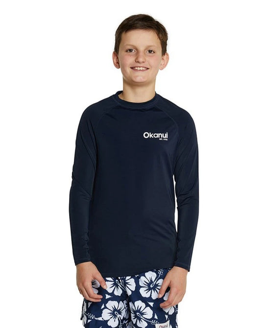 Navy blue long sleeve rushai for kids, paired with white and navy blue hibiscus flower shorts.