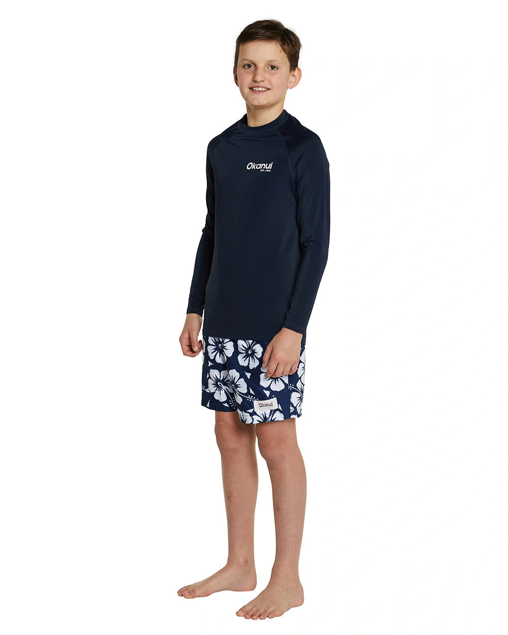 a navy blue long sleeve rashie with the white Okanui logo on the left side.