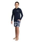 a navy blue long sleeve rashie with the white Okanui logo on the left side, paired with white and navy blue shorts.