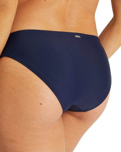 Close up back view of the  Okanui womens brief style bikini bottom swimsuit in Navy 