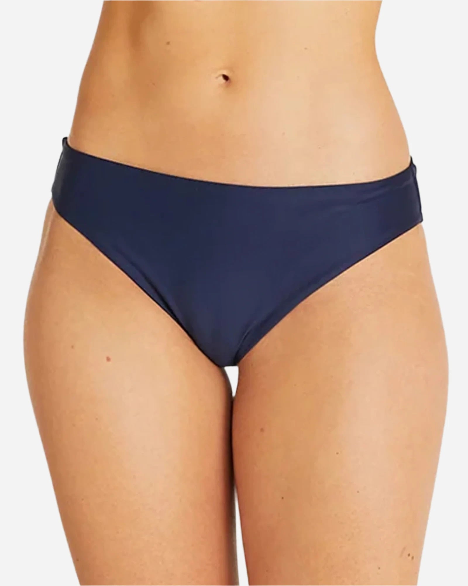 Close up view of a female model wearing the Okanui womens brief style bikini bottom swimsuit in Navy 