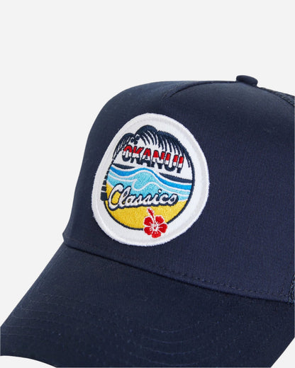 Close up view of the Okanui summer access classic badge snapback trucker cap