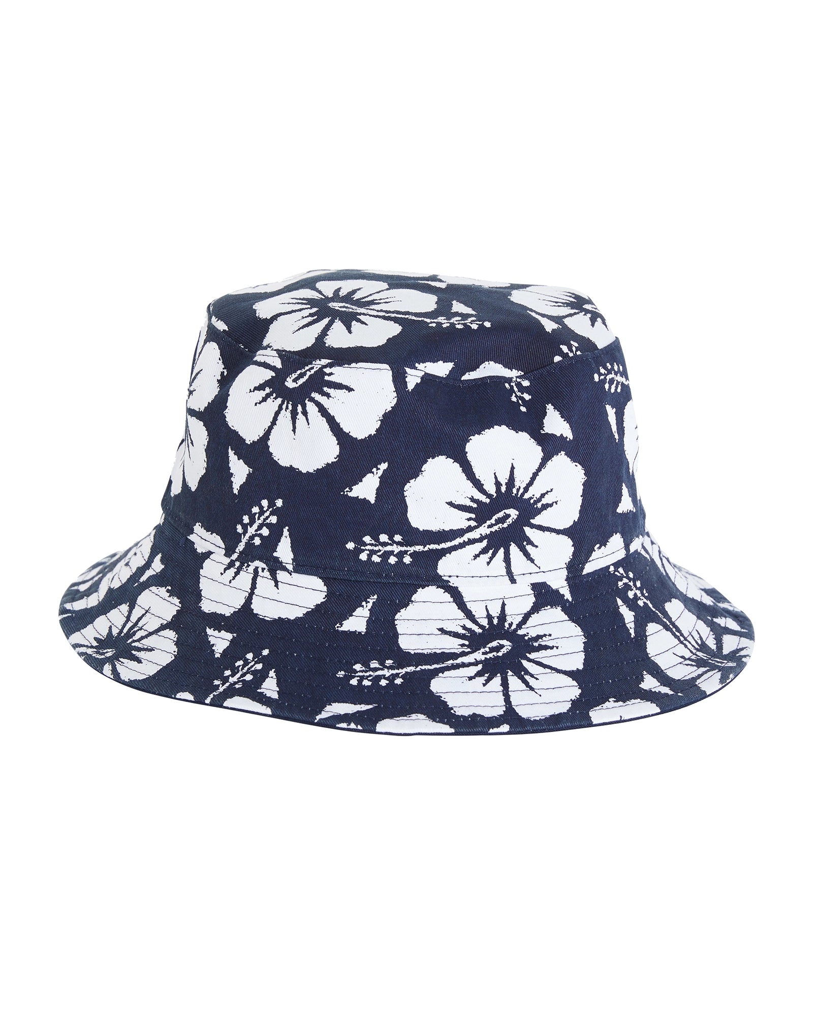 The Okanui Reversible Bucket Hat navy color when reversed features the signature Hibiscus flower print pattern in white.