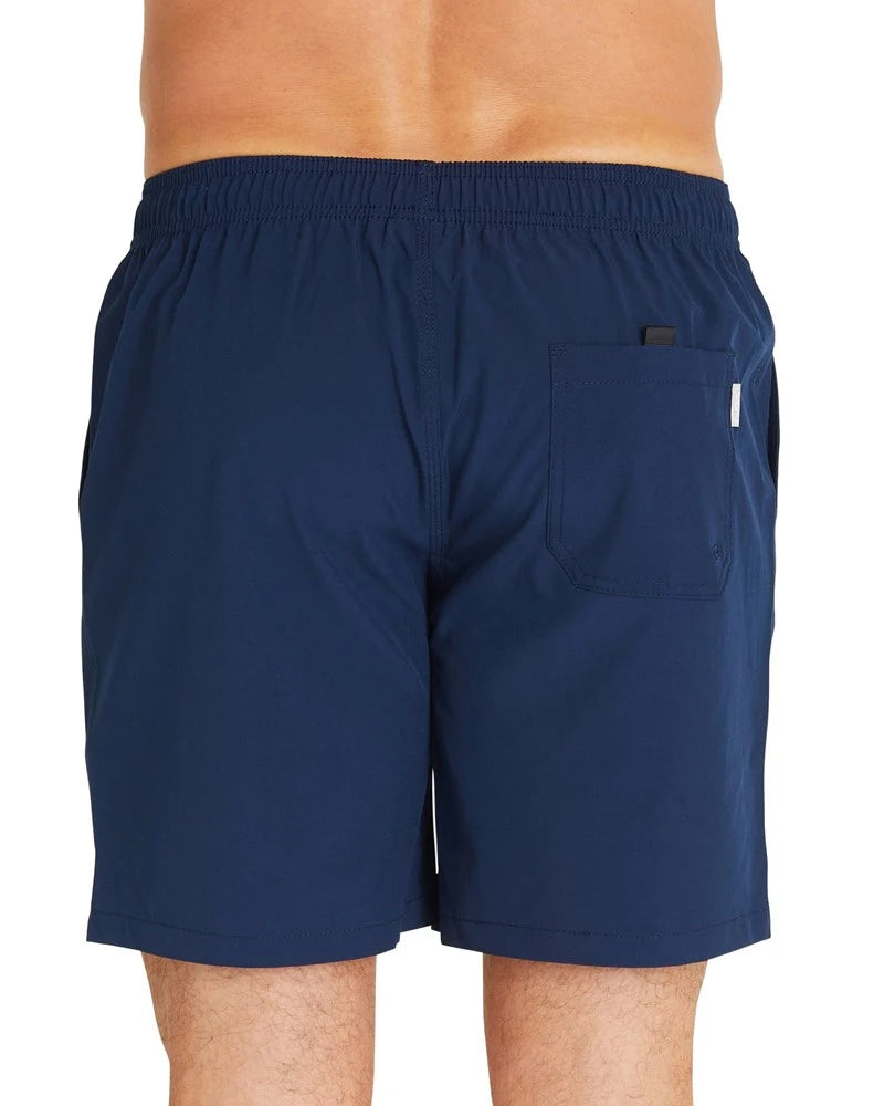 A close up view of the Okanui Classic Plain Shorts in navy color featuring the velcro back pocket.