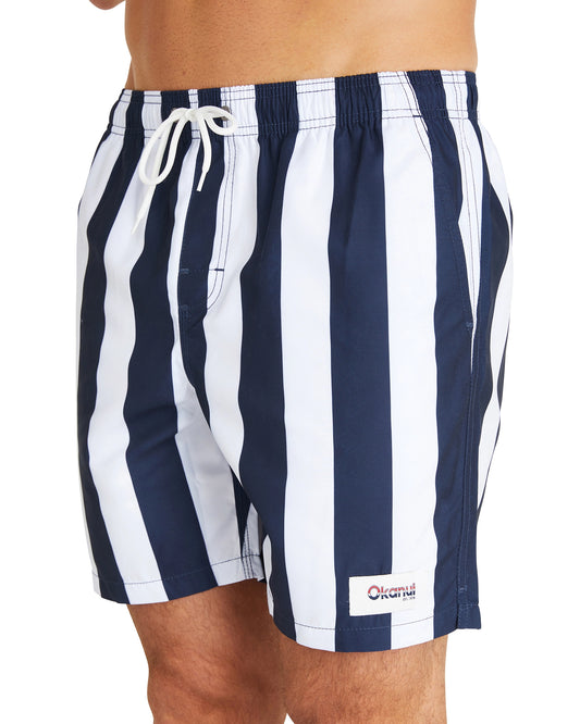 A close up photo of the Okanui Classic Stripe Swim Shorts with a vertical pattern of blue and white stripes.